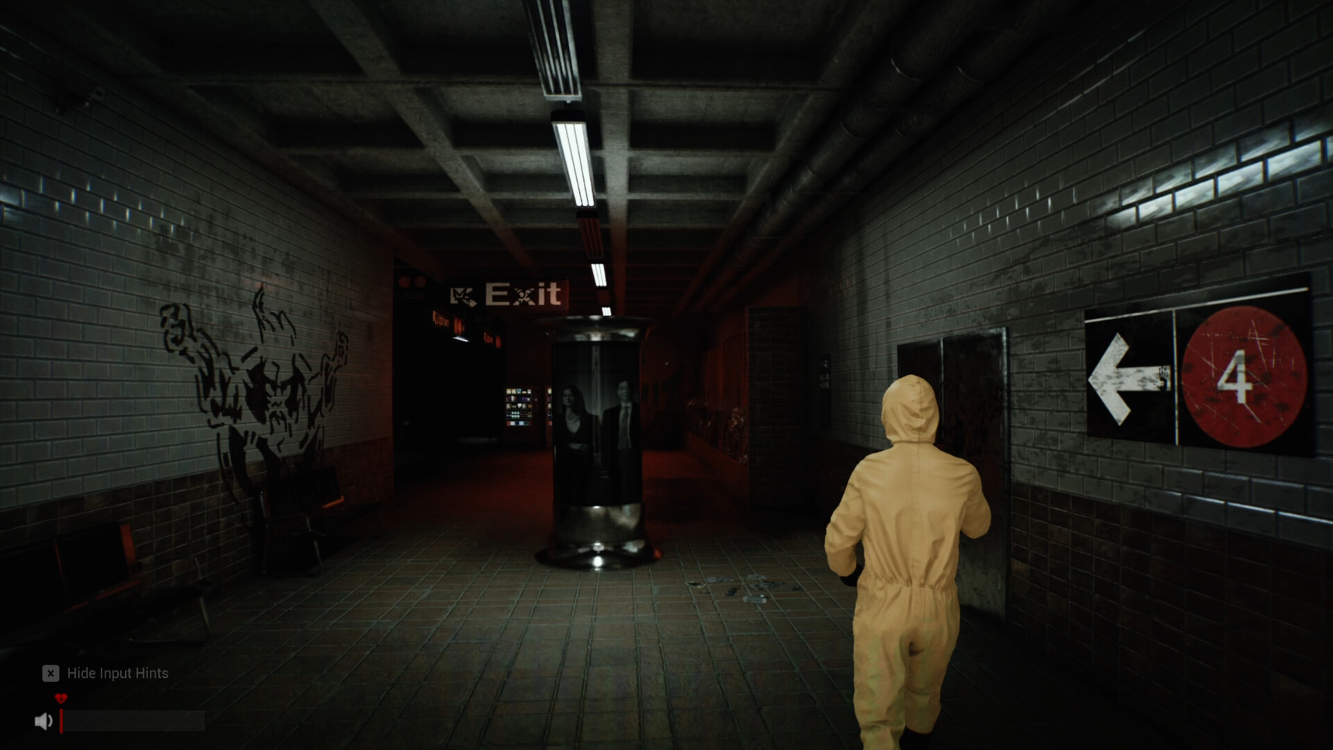 A yellow-raincoat agent walks toward the dark marked exit of an underground passage