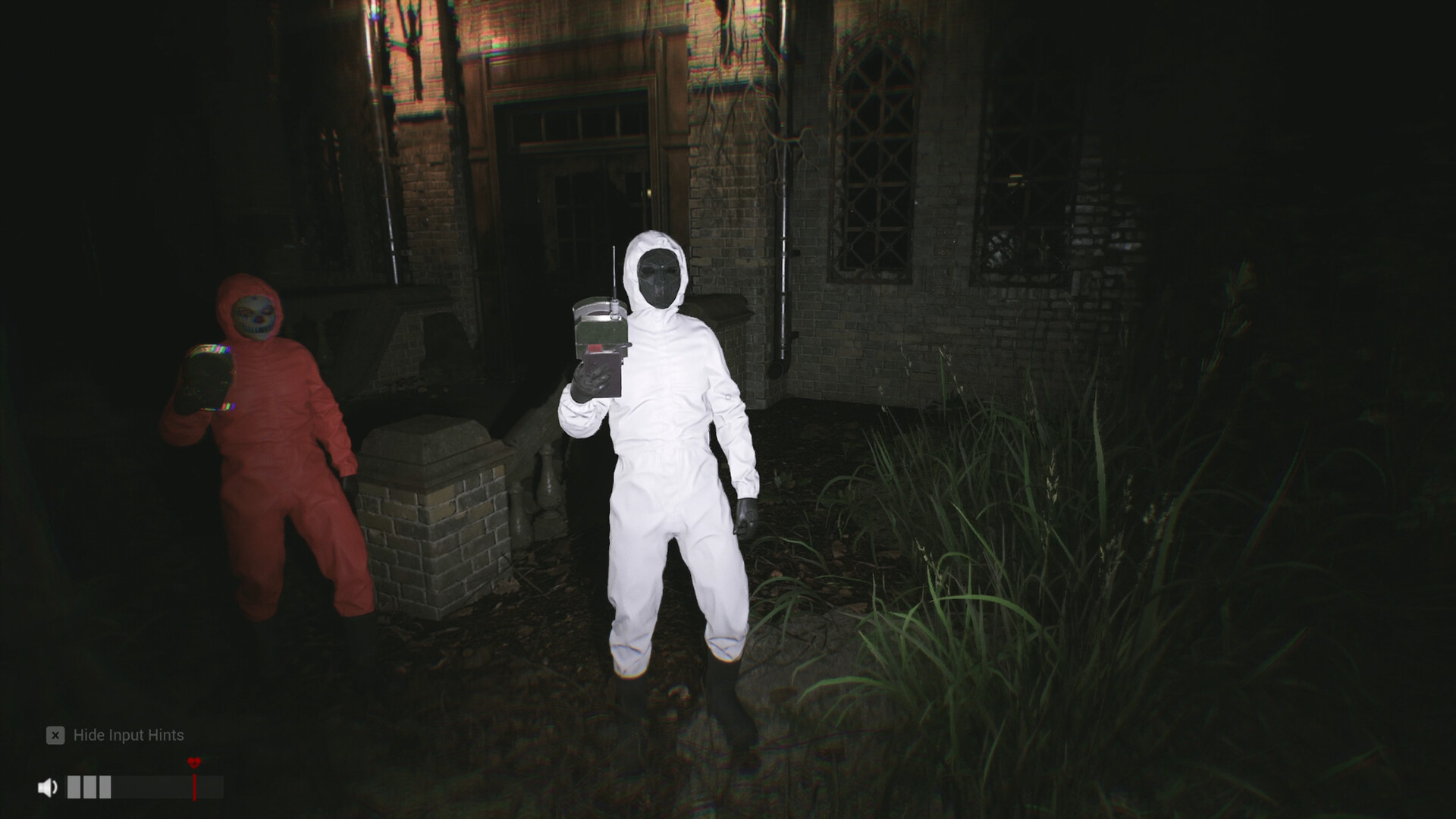 Agents gathered at the entrance of a wooden cabin at night
