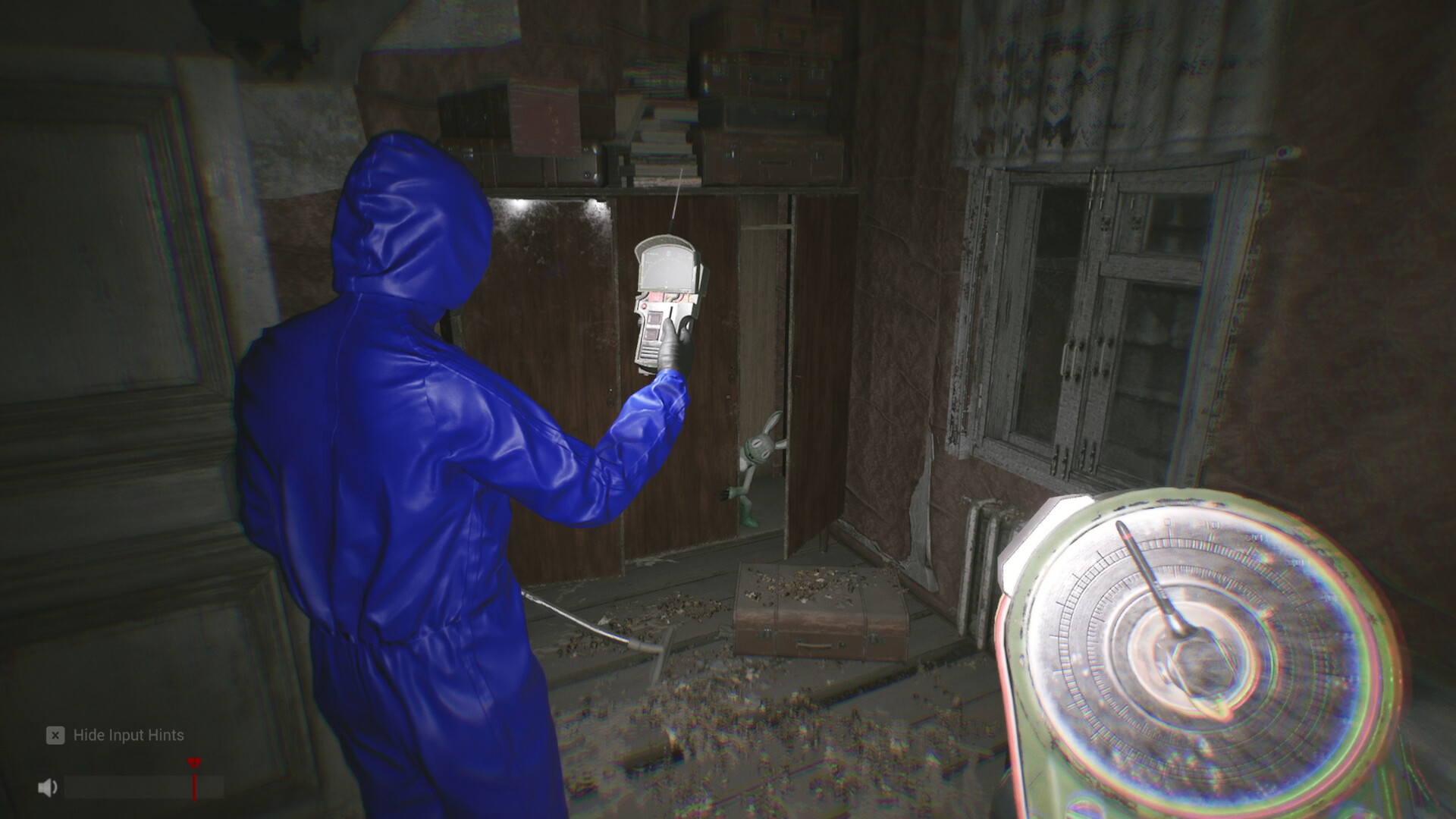 An agent stands beside a glowing artifact-like object indoors